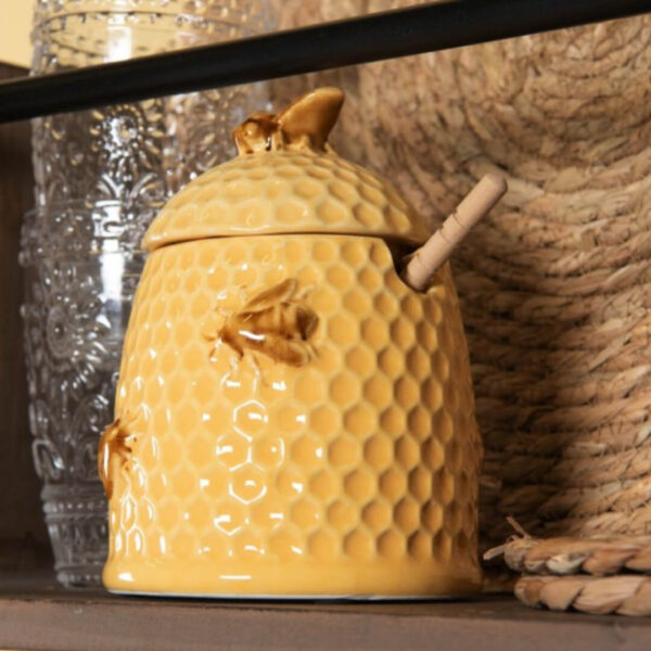 Pote em cerâmica para mel com colher de madeira